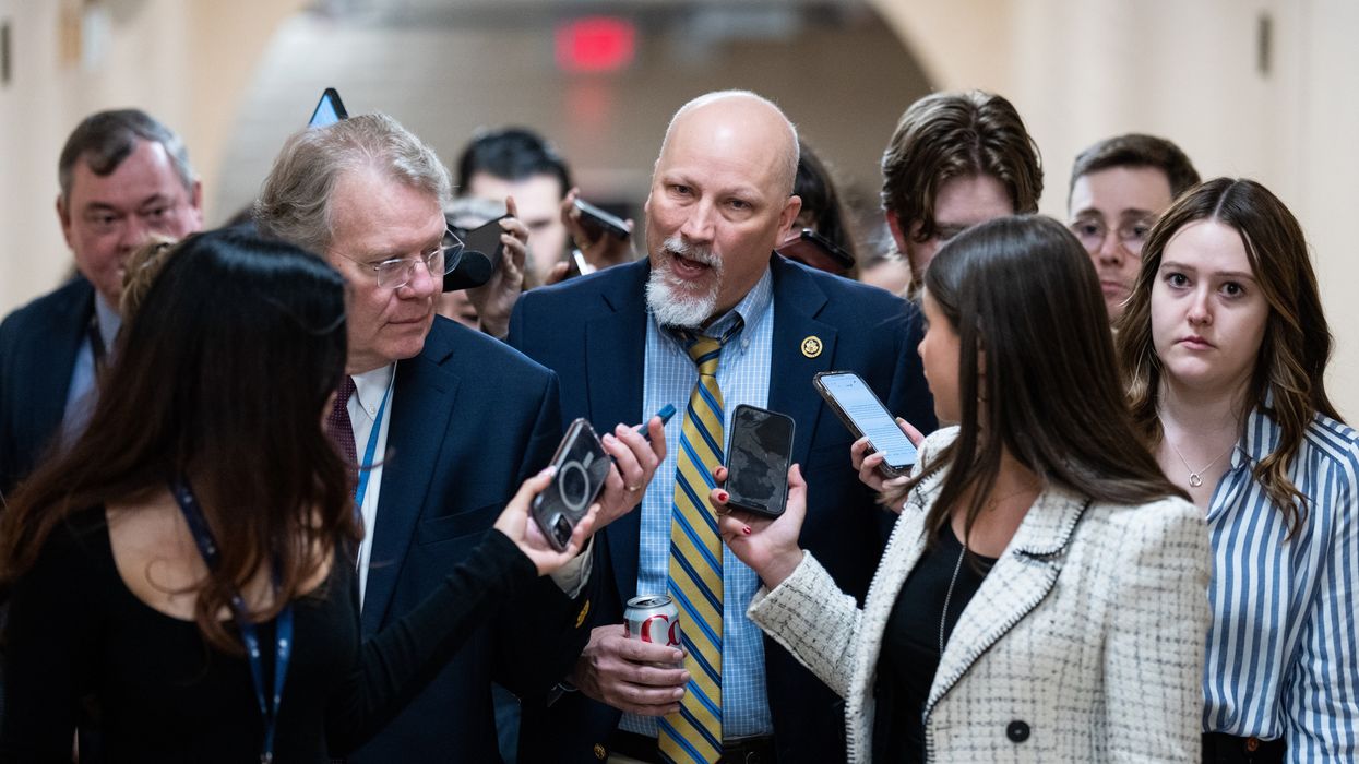 Man speaking to reporters in the Capitol