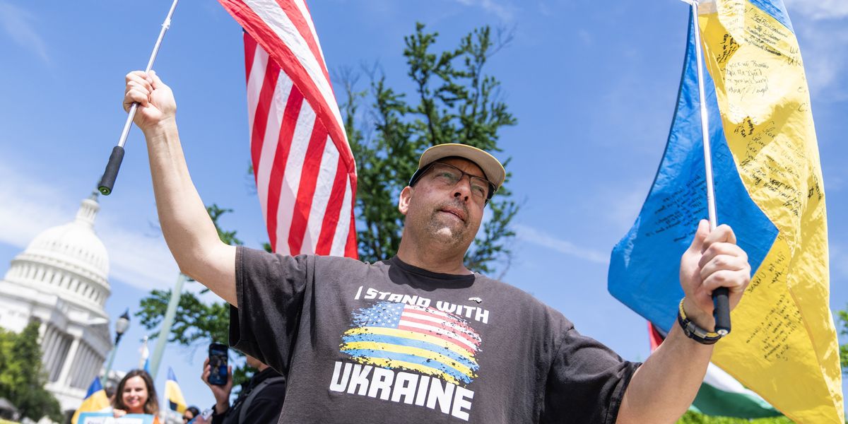 Man waving U.S. and Ukrainian flags