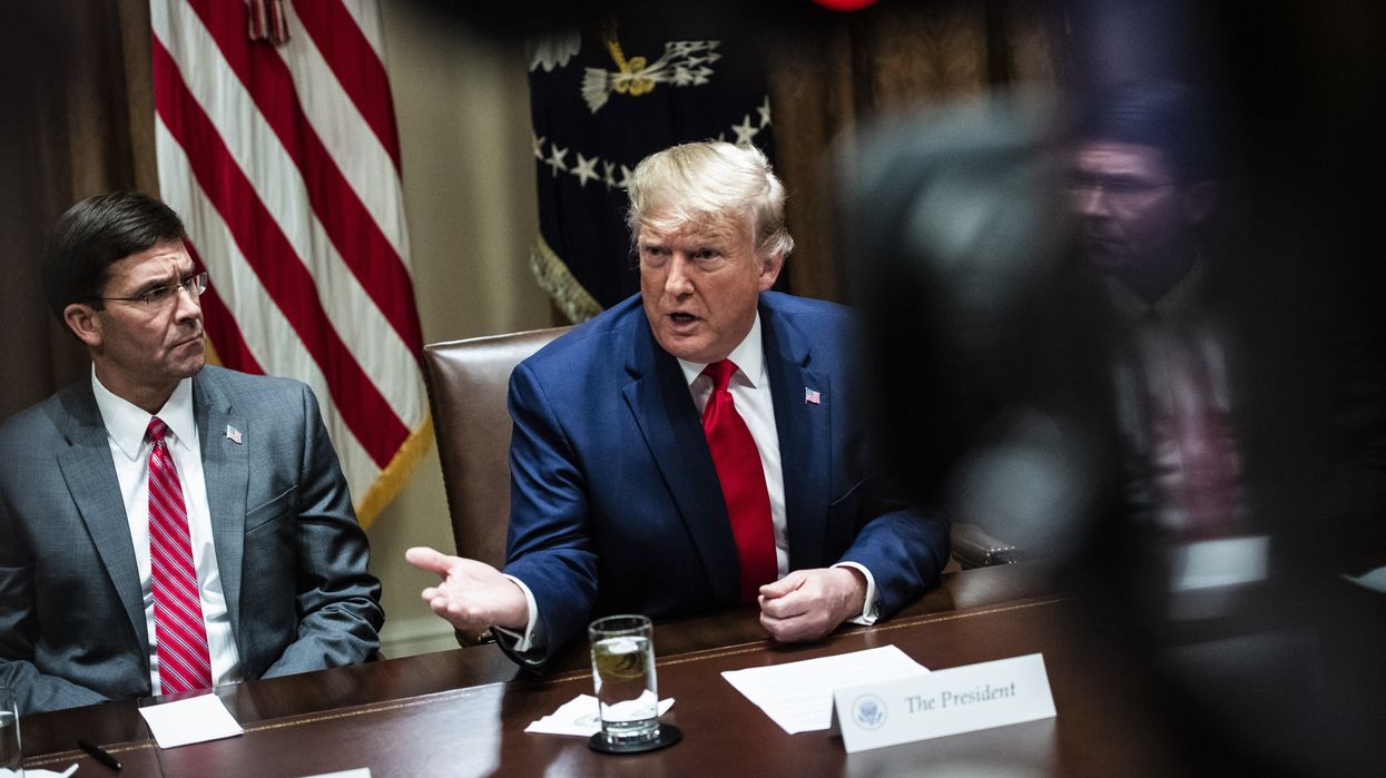Mark Esper sitting next to Donald Trump