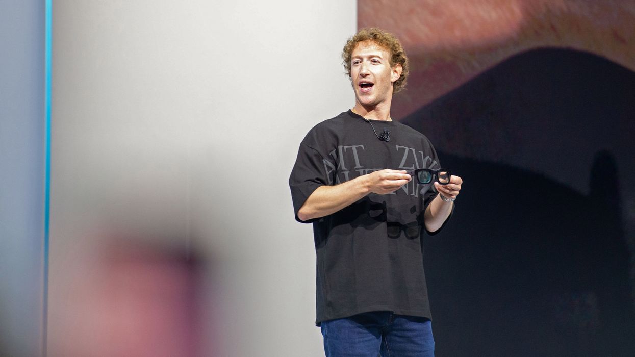 Mark Zuckerberg holding a pair of glasses