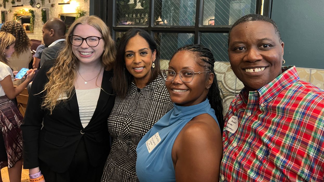 Maya Harris poses with event attendees