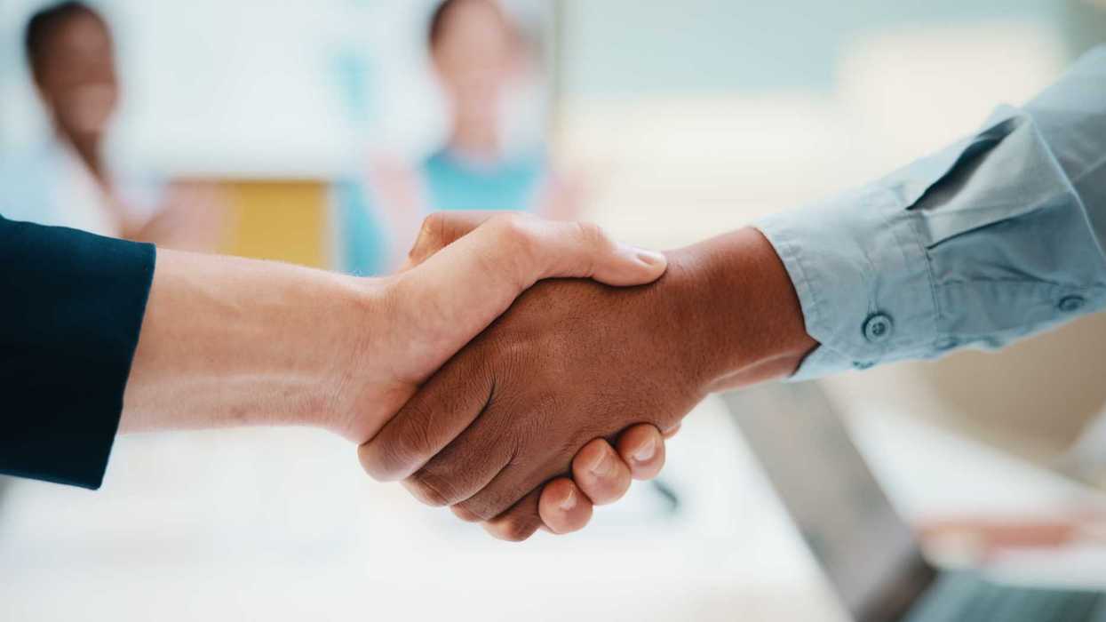 Meeting, handshake and business people with deal in office for funding approval and success.