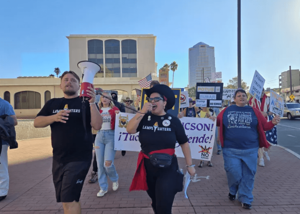 Members of the Tucson se Defiende Coalition say \u201cpresente\u201d as they march through downtown Tucson