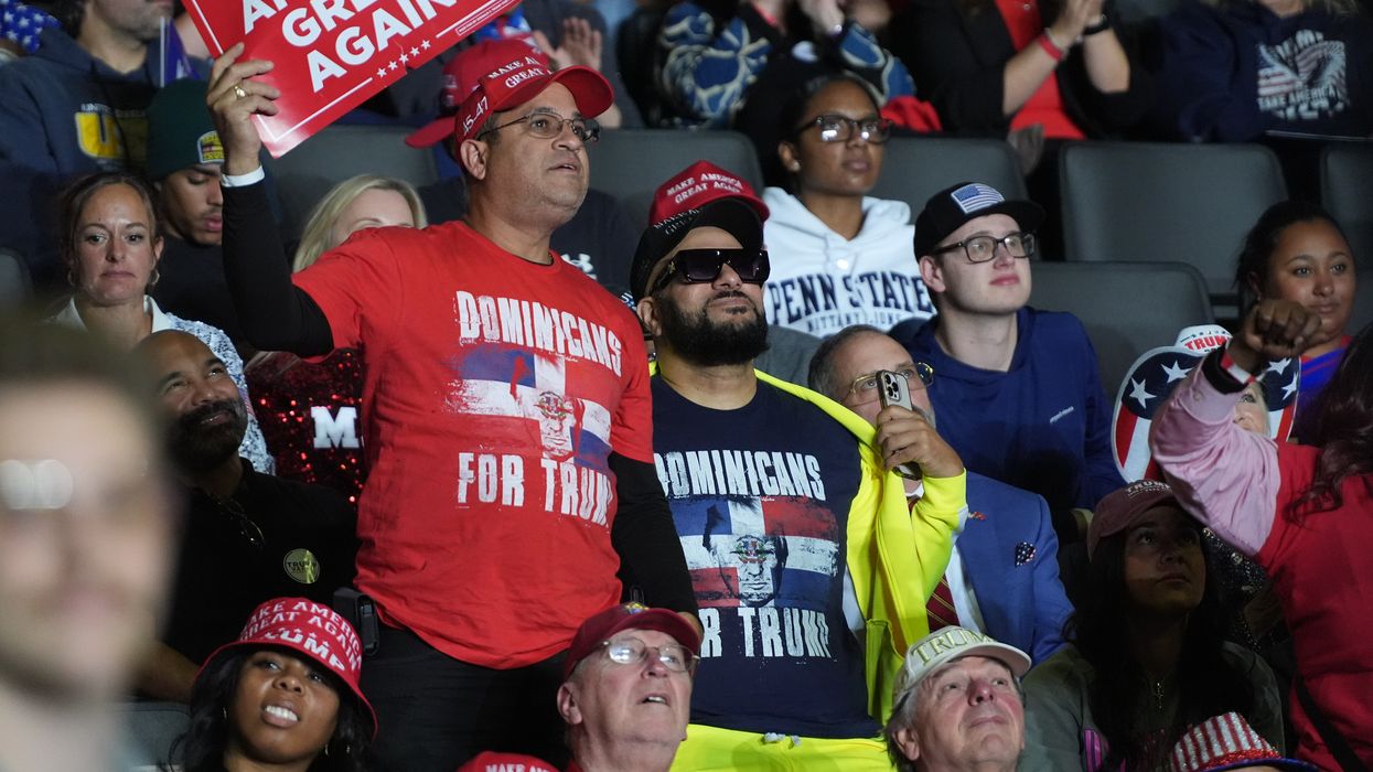 Men in "Dominicans for Trump" shirts