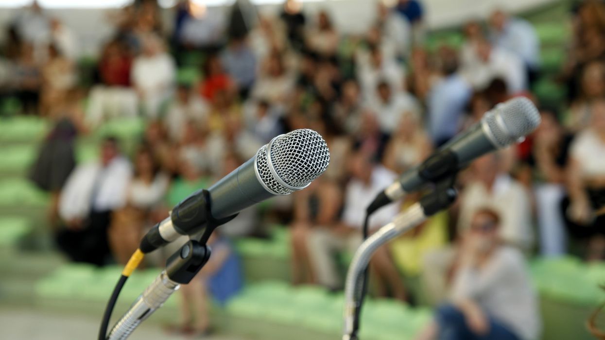 Microphones, crowd, speech, event.