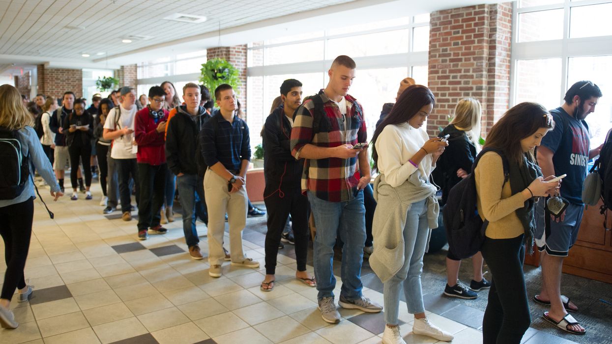 Millennial voters standing in line.