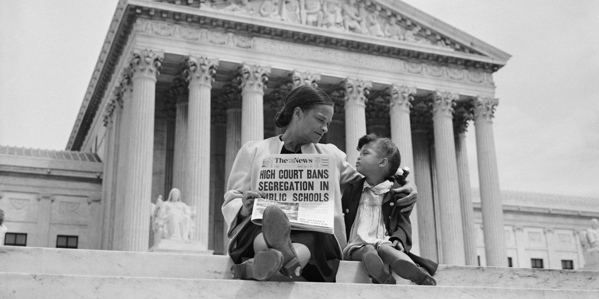 Mother and daughter sit outside the Supreme Court