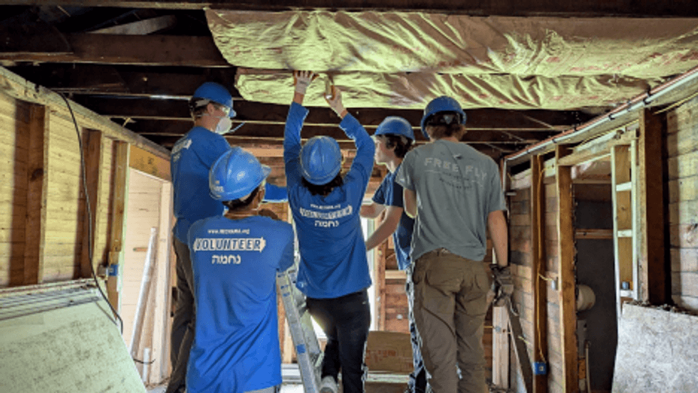 NECHAMA volunteers work alongside local residents