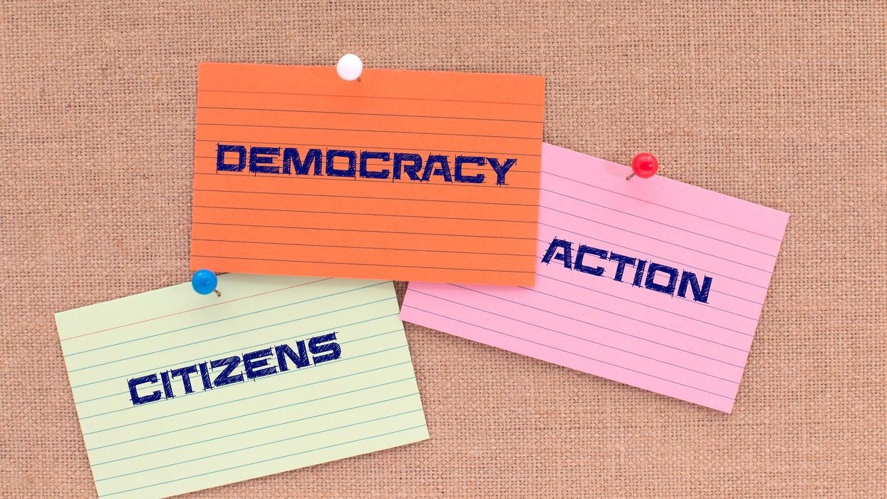 Notecards saying "democracy," "citizens" and "action"