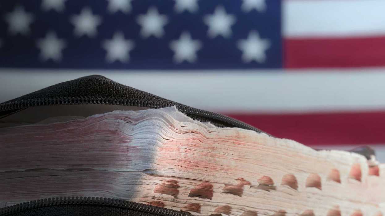 Old Bible with background of American flag