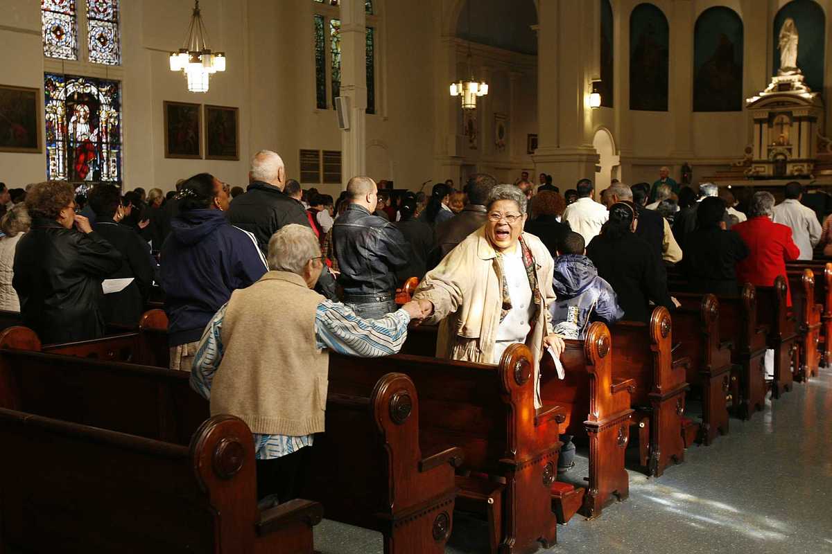 Peace and Friendship Handshake During Mass in St Mary's Roman Catholic Church