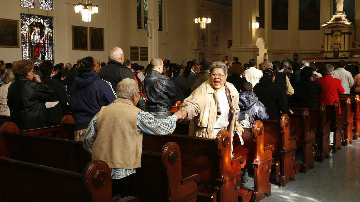 Peace and Friendship Handshake During Mass in St Mary's Roman Catholic Church