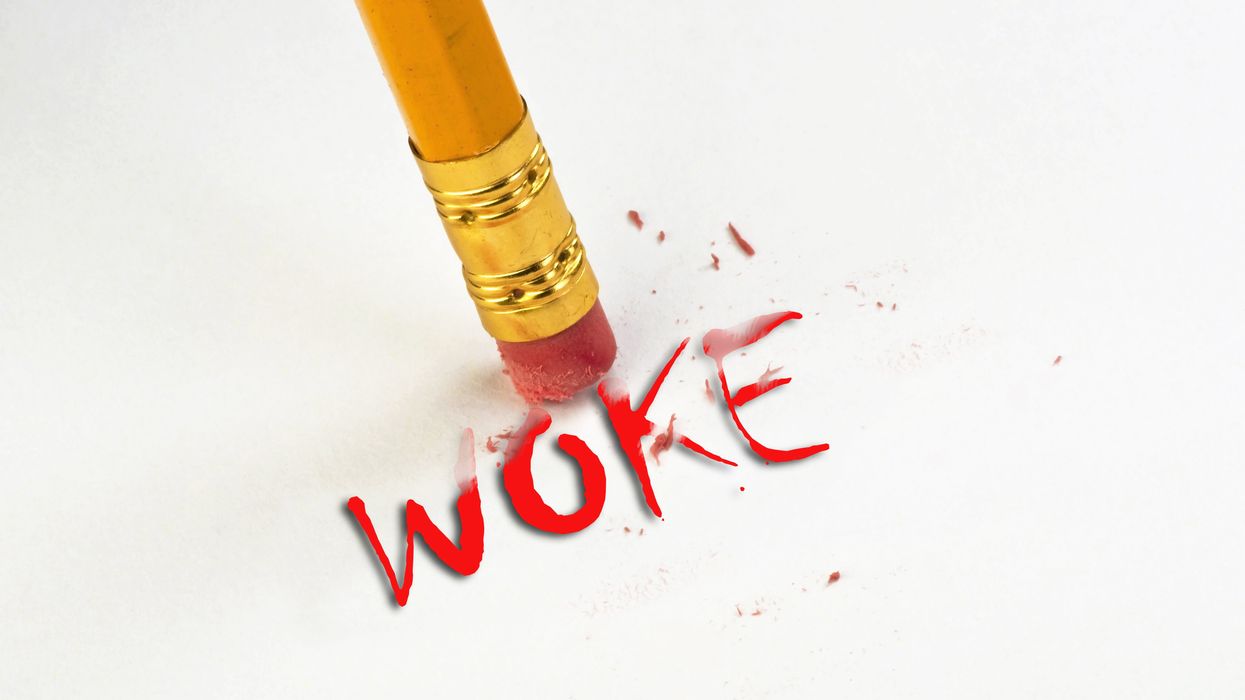 Pencil erasing the word "woke"