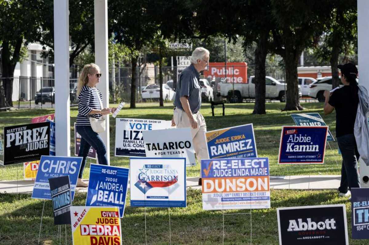 People arrive at a polling location on the first day of early voting in Texas