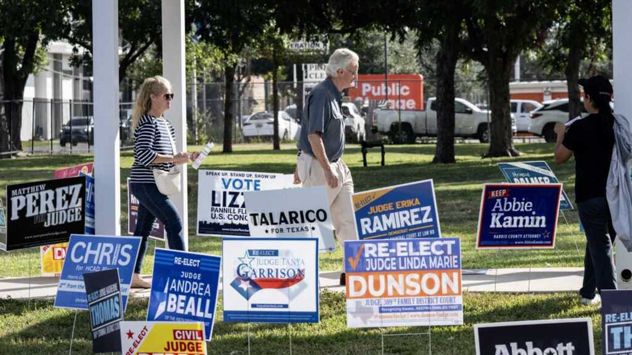 People arrive at a polling location on the first day of early voting in Texas