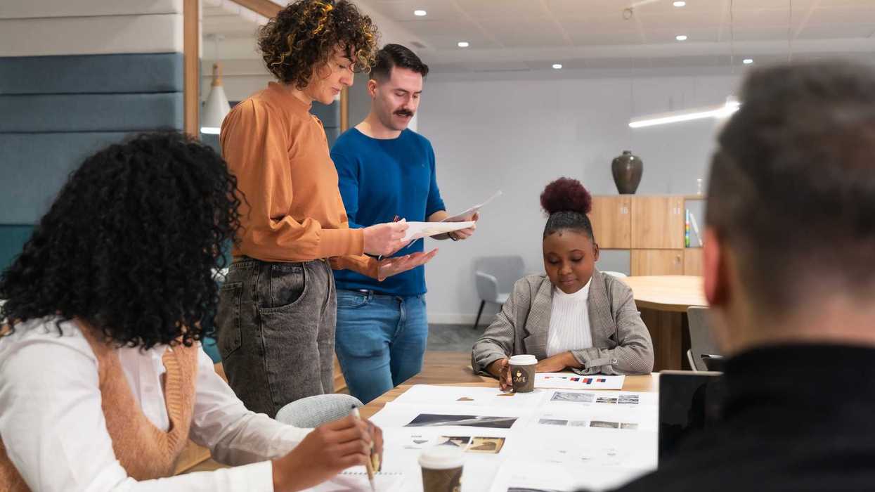 People at a table looking at papers.