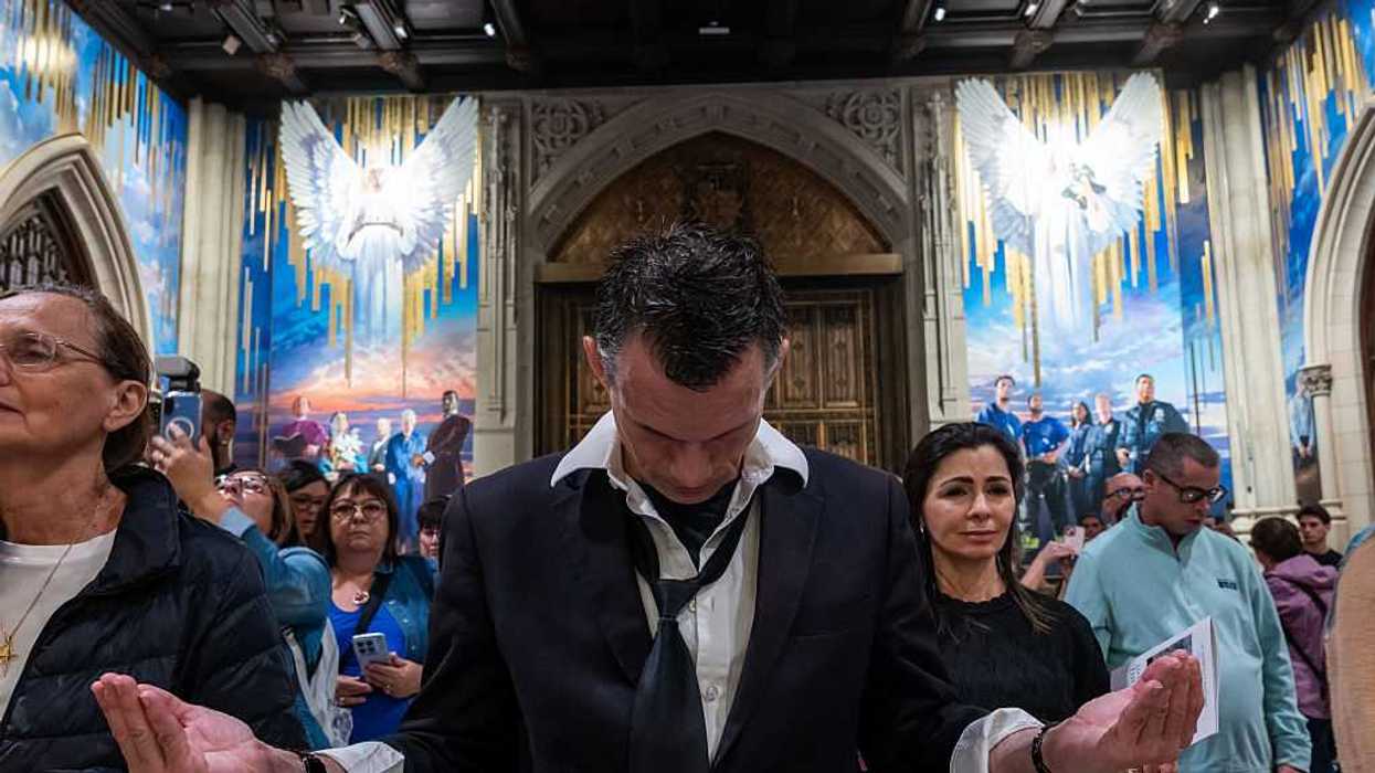 people attend a mass and ceremony