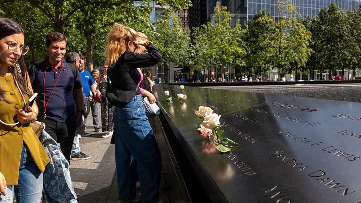 People gather at the National September 11 Memorial & Museum.