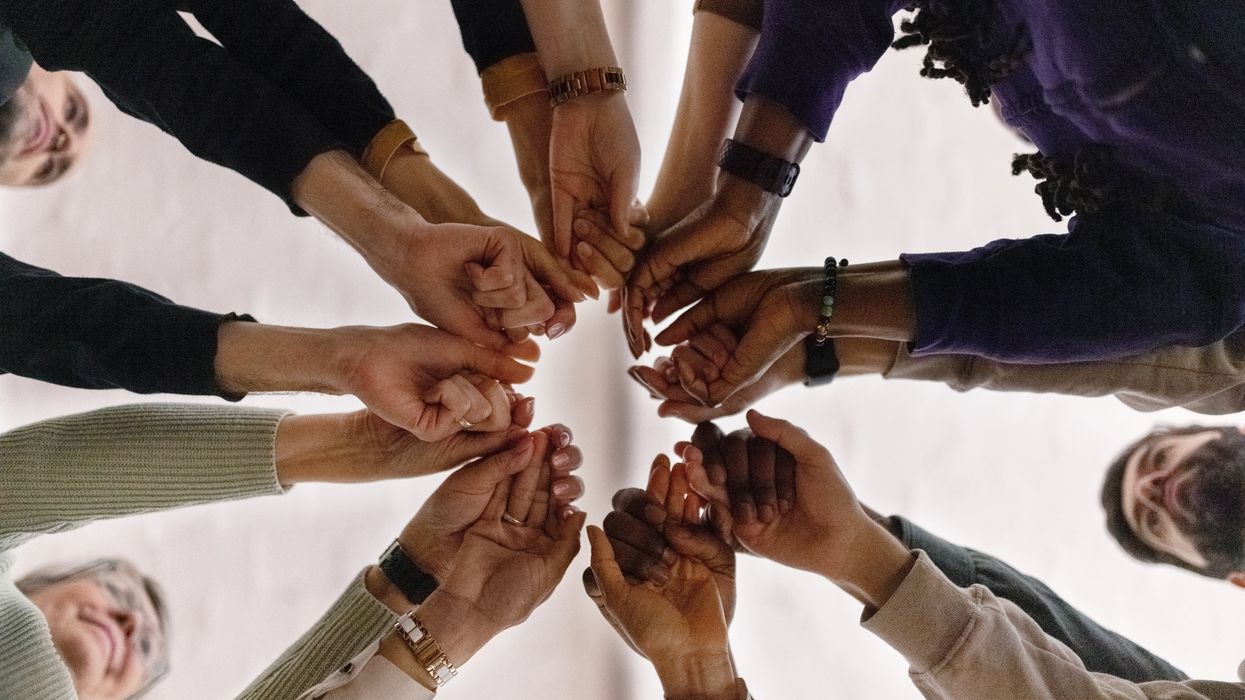 People holding hands in a circle