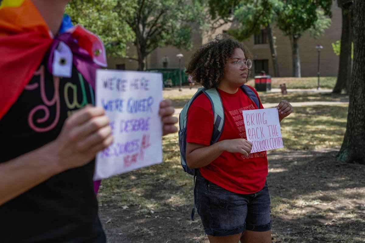 People holding protest signs