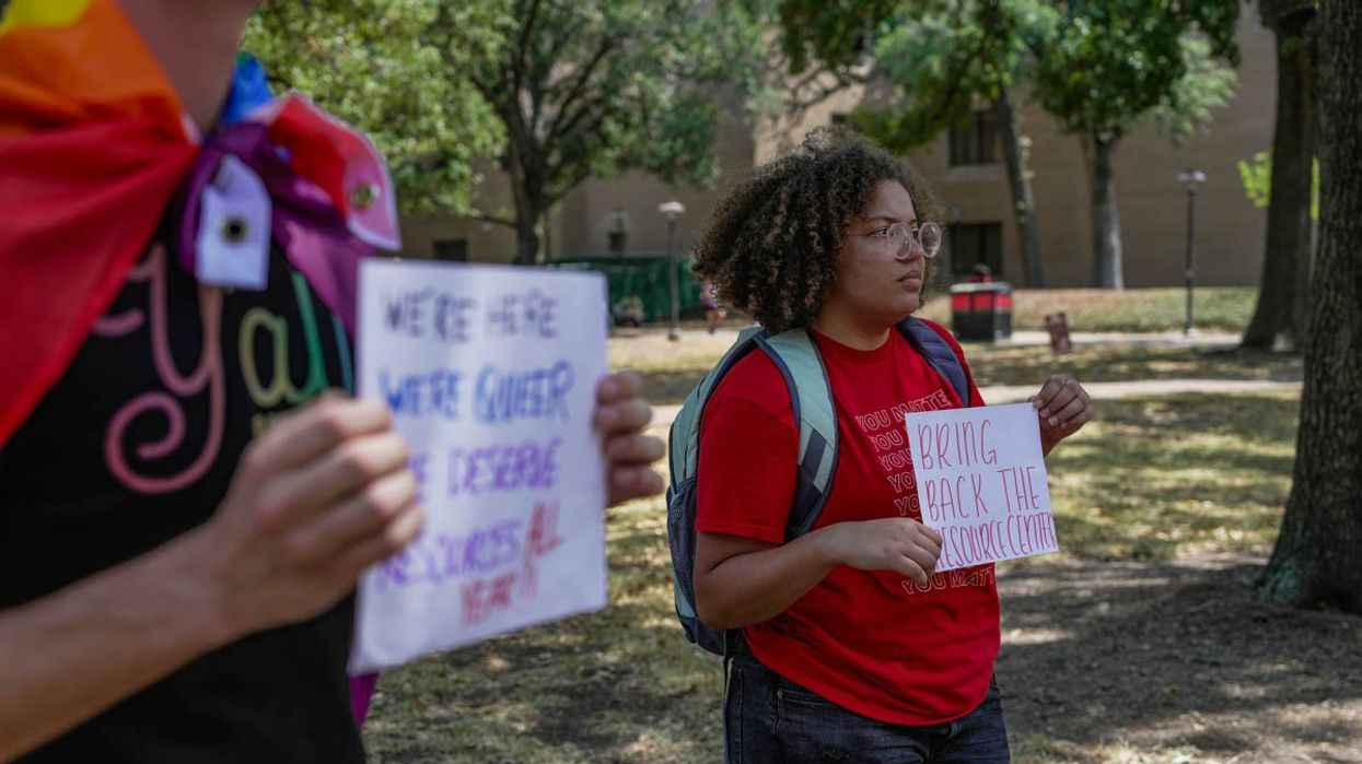 People holding protest signs