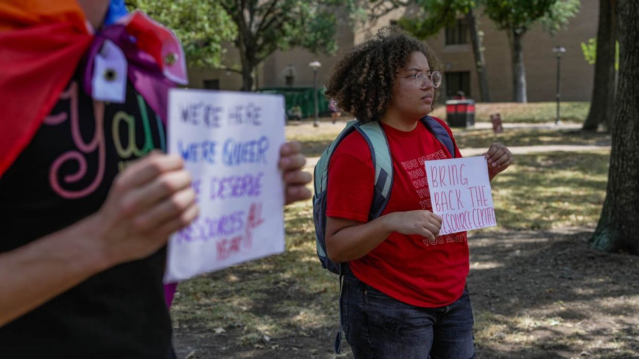 People holding protest signs