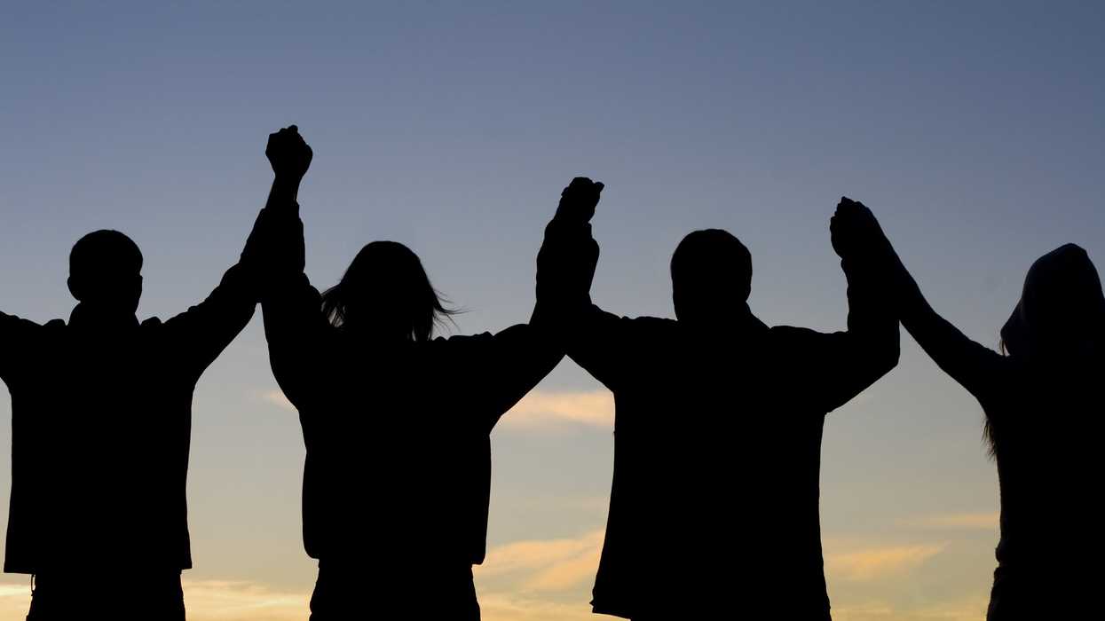 People joined hand in hand.