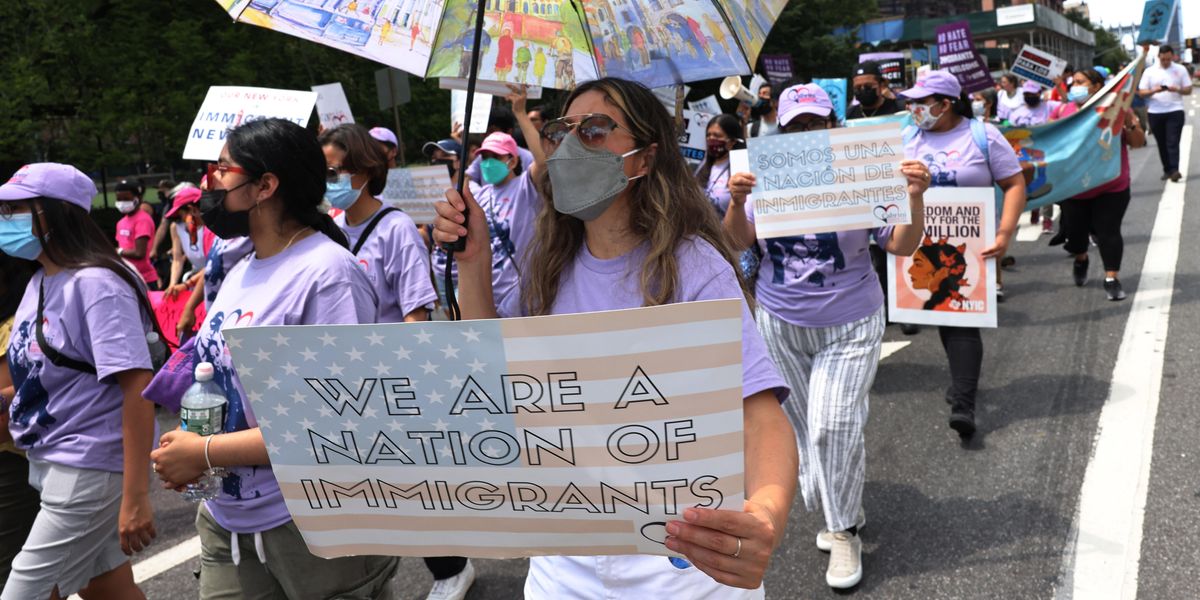 People participate in a march in support of a pathway to citizenship for immigrants on July 23, 2021 in New York City.
