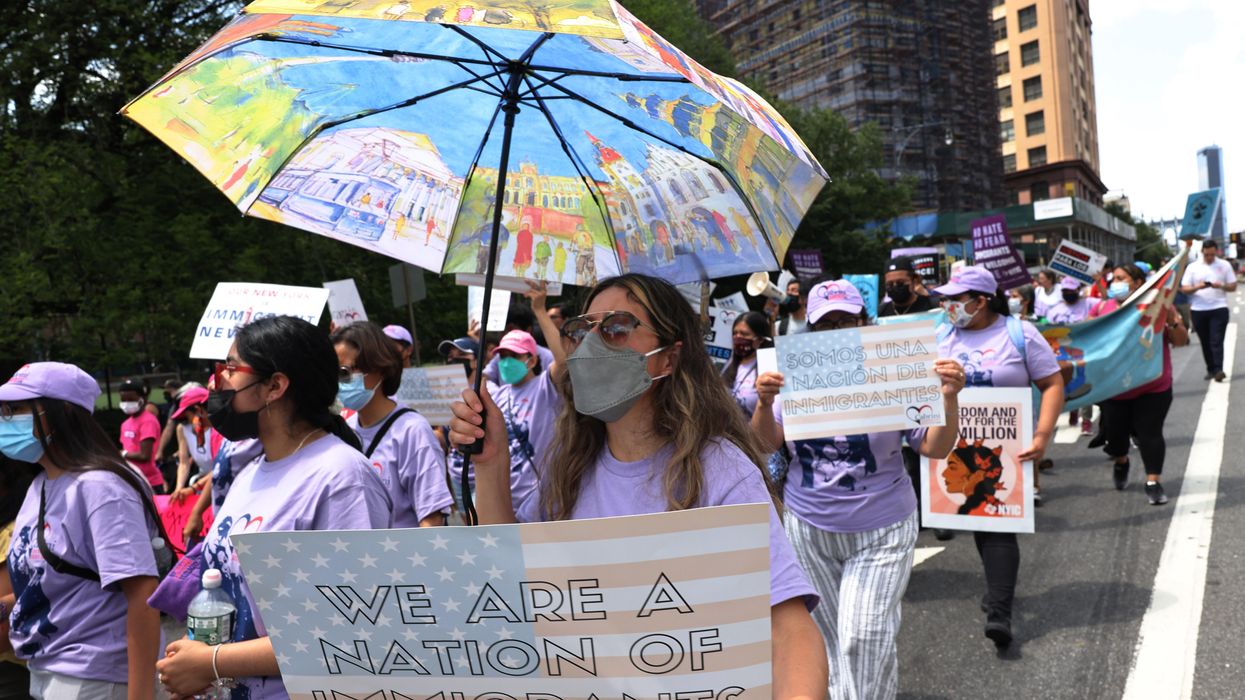 People participate in a march in support of a pathway to citizenship for immigrants on July 23, 2021 in New York City.