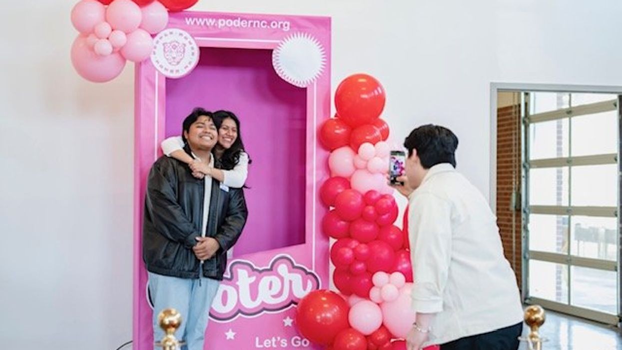 People posing in a photo booth