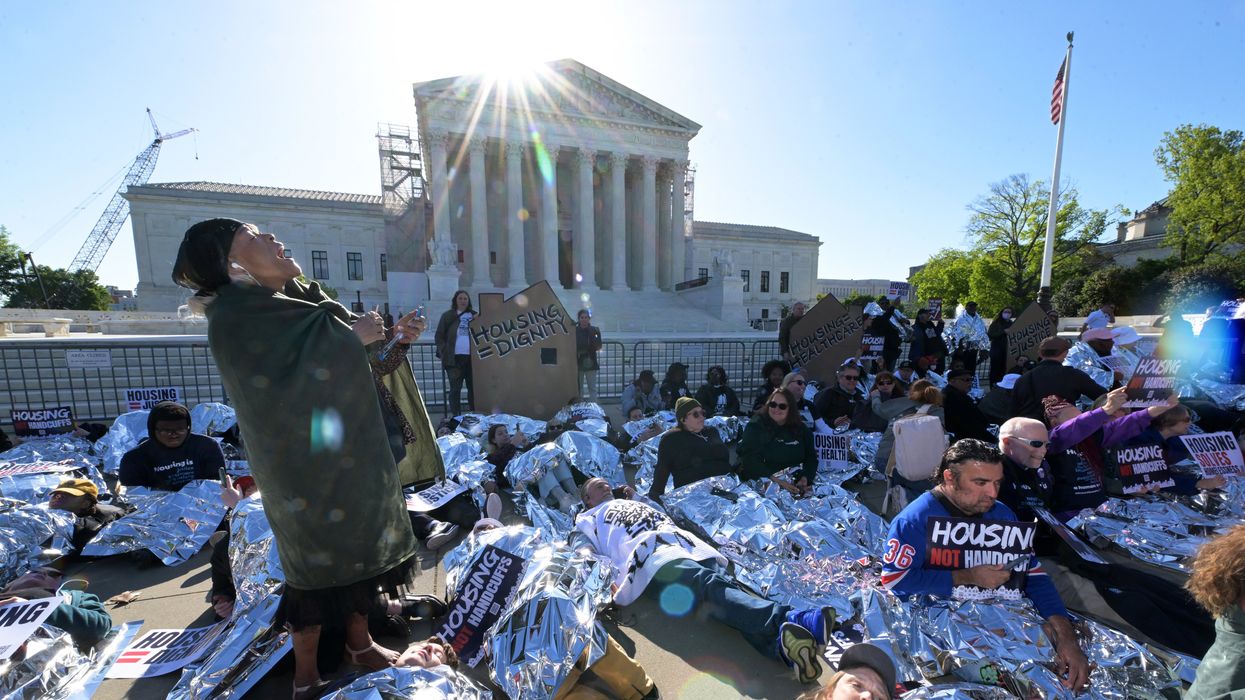 People protesting laws against homelessness
