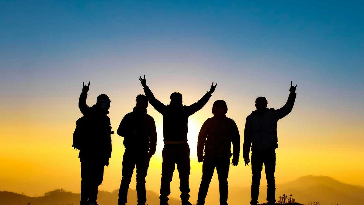 people raising their hands