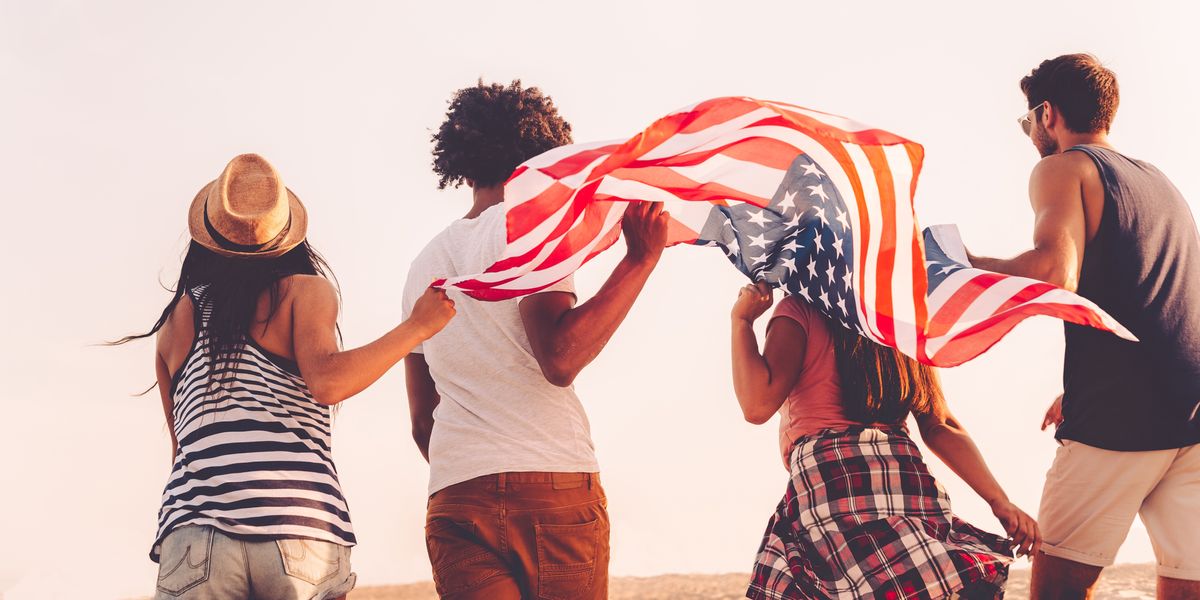 people running with an American flag