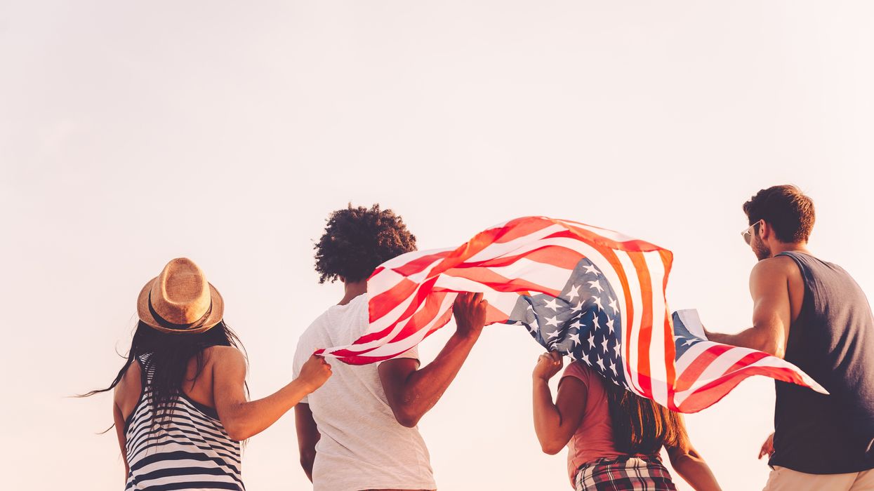 people running with an American flag