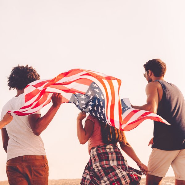people running with an American flag