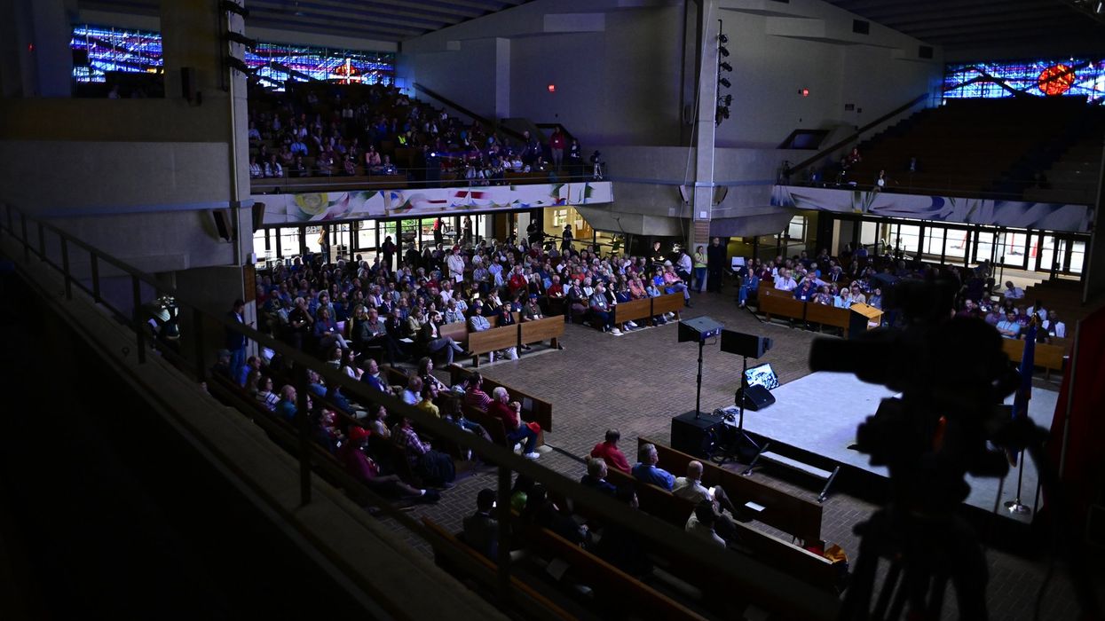 People seated ina  large room
