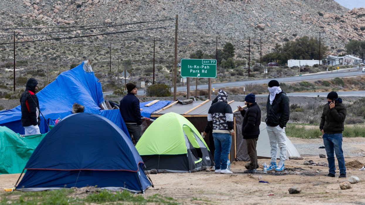 People standing near tents