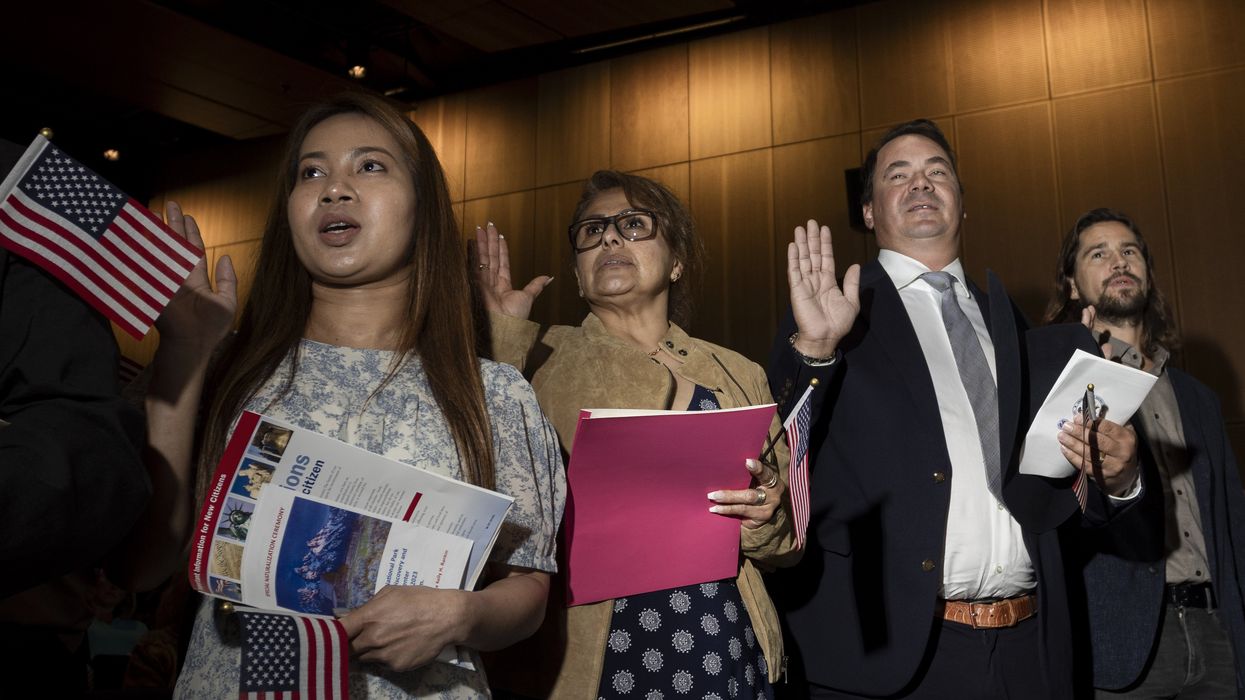 People taking citizenship oath