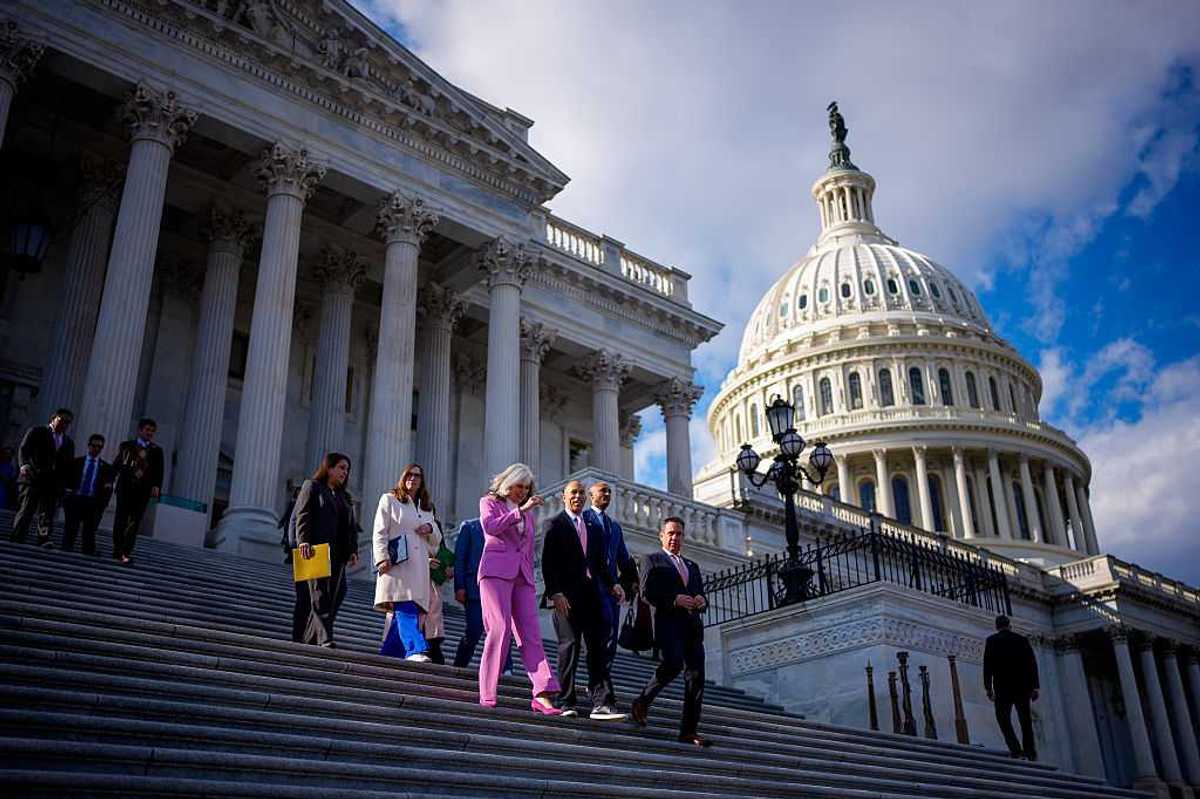 People walking down the steps of the U.S. capitol.