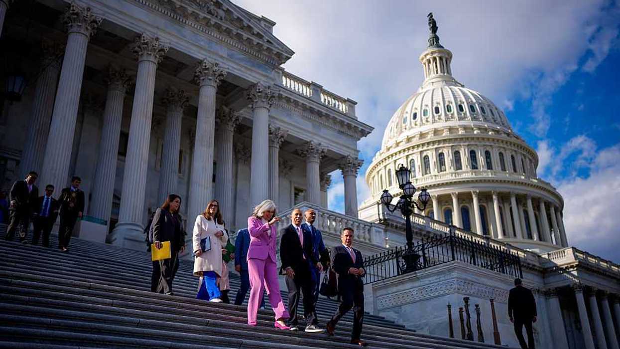 People walking down the steps of the U.S. capitol.