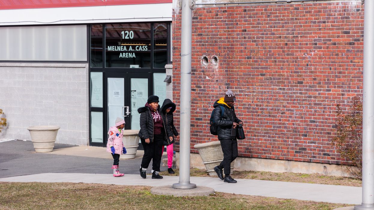 People walking in front of a building