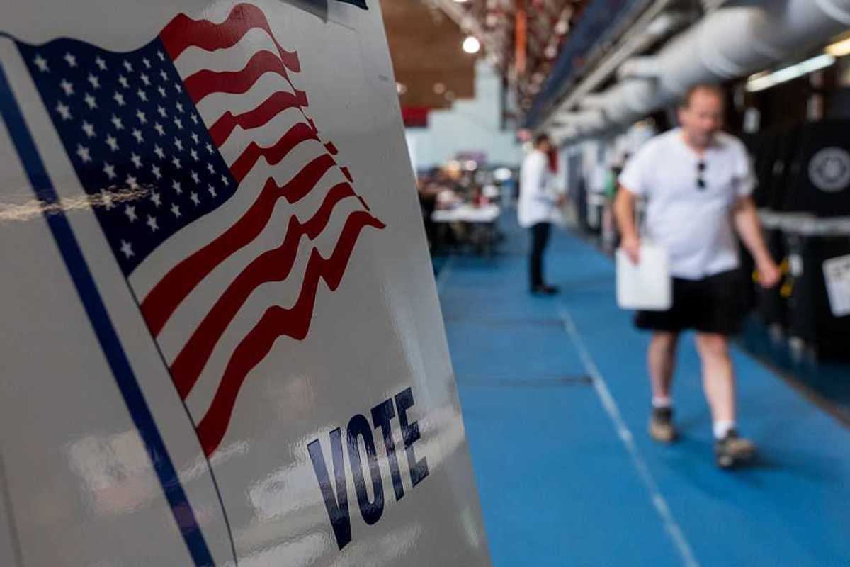 People walking to voting booths.