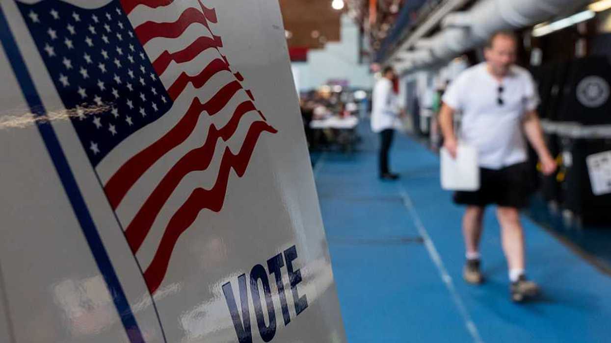 People walking to voting booths.