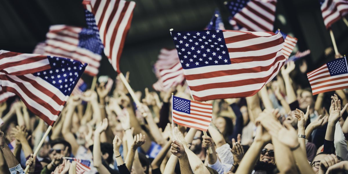 People waving American flags