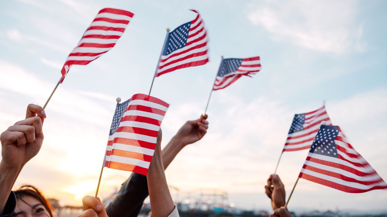 People waving US flags