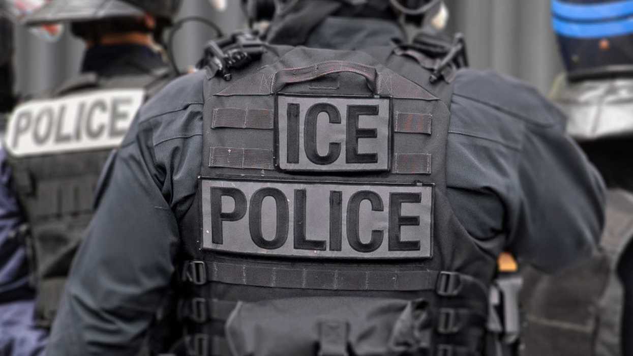 People wearing vests with "ICE" and "Police" on the back.
