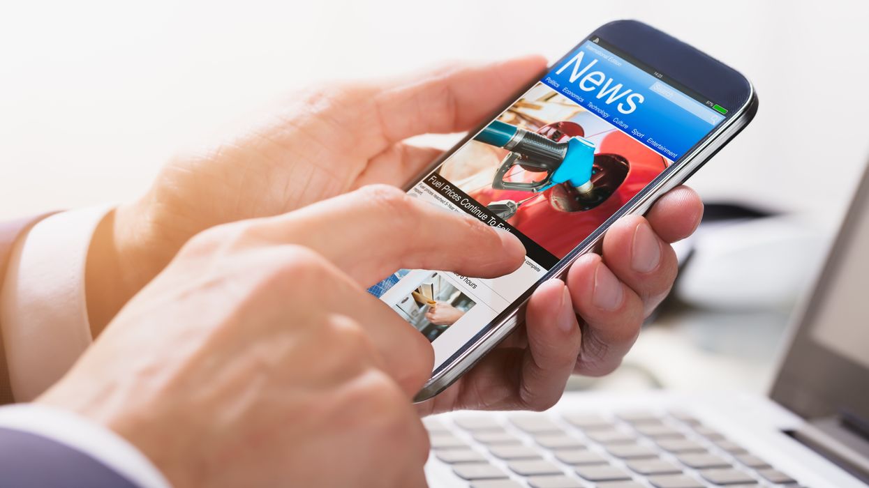 Person reading news on a phone