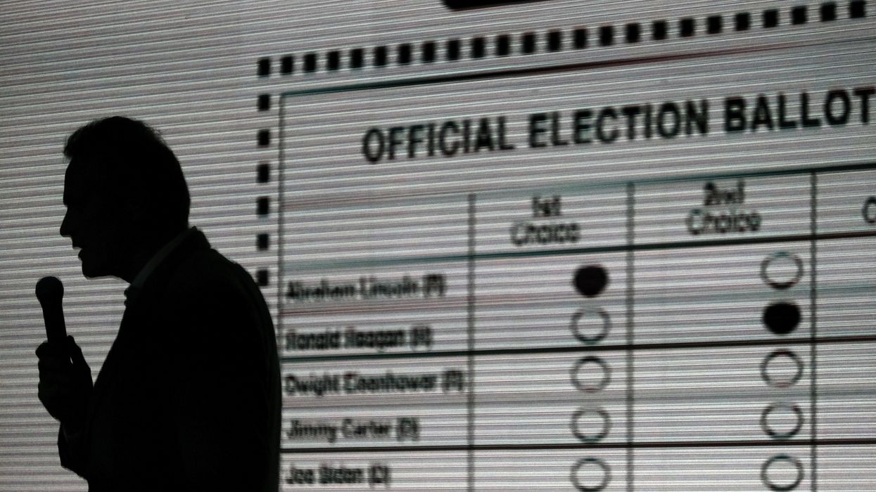 Person standing in front of sampe RCV ballot