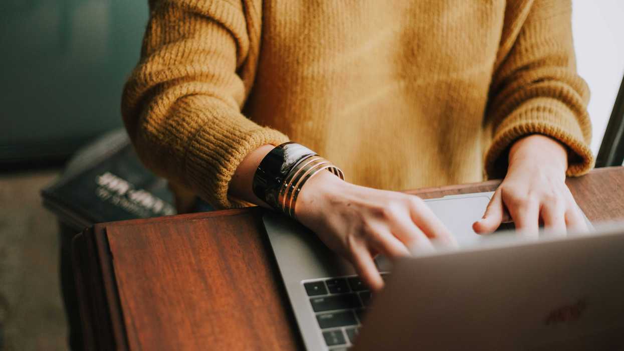 person typing on computer