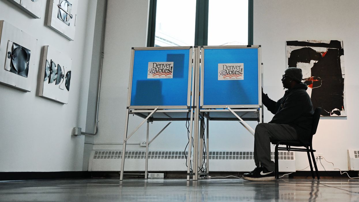 Person voting in Denver